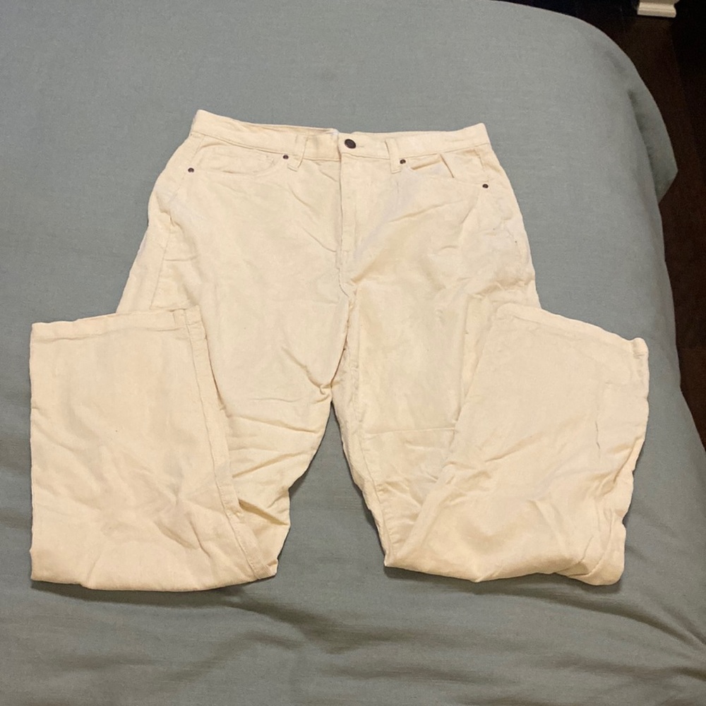 Cream colored corduroy pants.